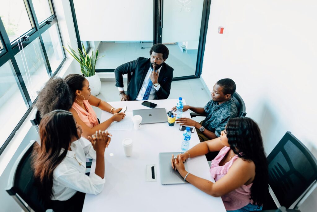 Business owners in a strategy meeting at a modern boardroom table